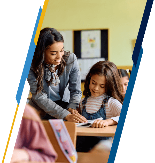 Female educator helping an elementary school student