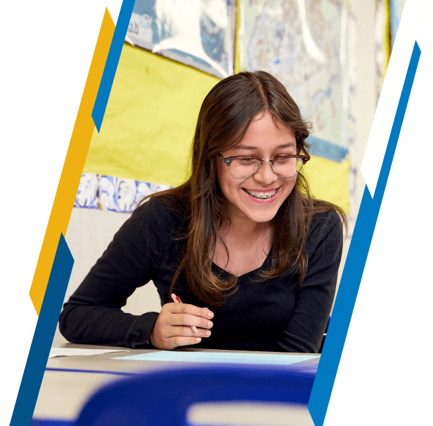 High school student writing in class