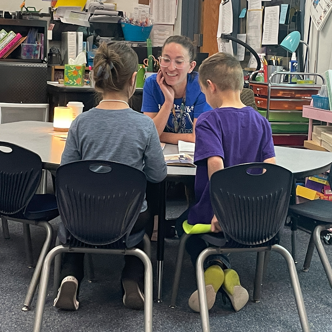 Marana Unified School District teacher interacting with two students